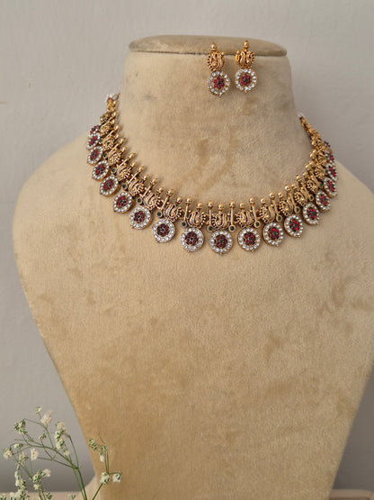 Handcrafted antique gold statement jewelry set showcasing intricate metallic engravings and crystal embellishments, by naitri.in