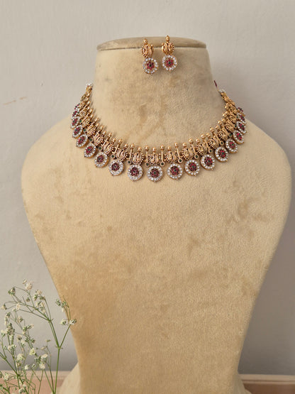 Antique gold choker necklace with dangling circular coin charms and matching earrings, by naitri.in