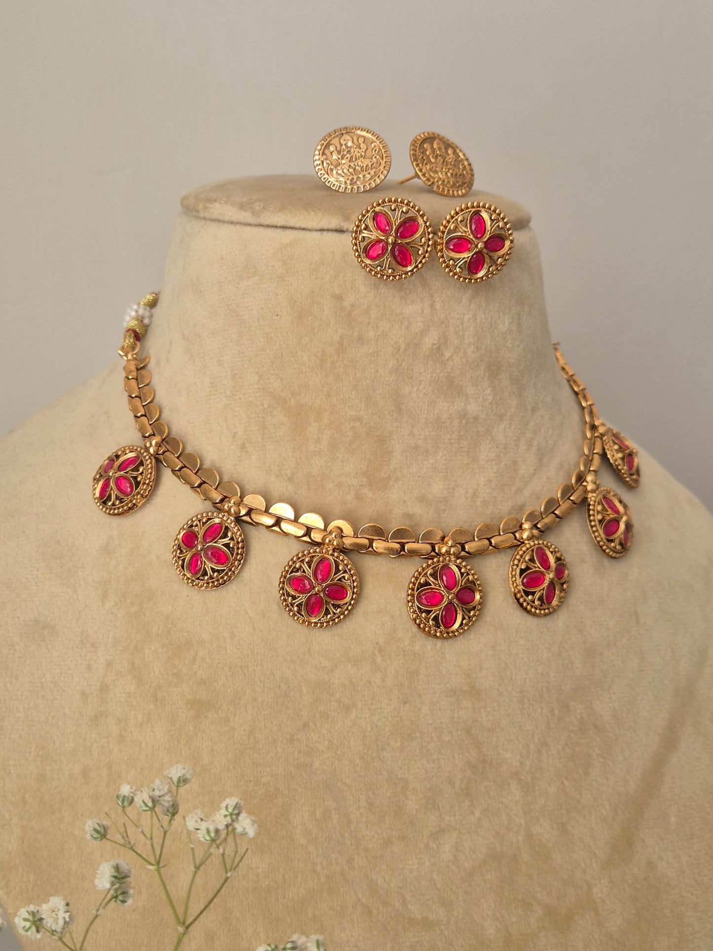 Gold-plated Abhilasha necklace and earring set with pink stone accents and traditional Indian craftsmanship by naitri.in