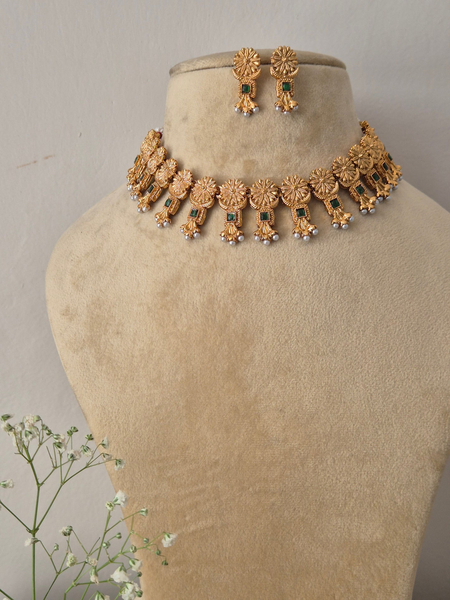 Ornate hand-crafted antique gold statement necklace and earring set, Traditional Indian style golden brass alloy choker necklace and earrings set from the NAITRI jewellery collection by naitri.in 