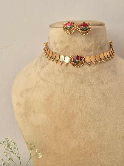 Elegant lotus-themed gold-toned traditional choker jewelry set Naitri gold-plated Akira choker and earring set with lotus motifs by naitri.in