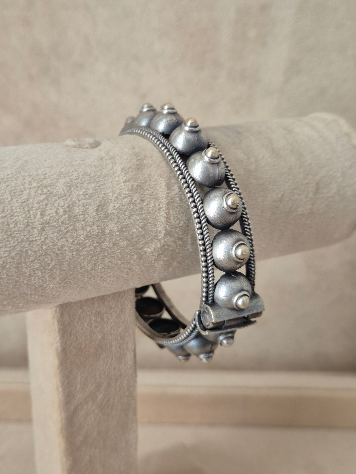 Intricately detailed silver oxidized geometric bangle bracelet by naitri.in