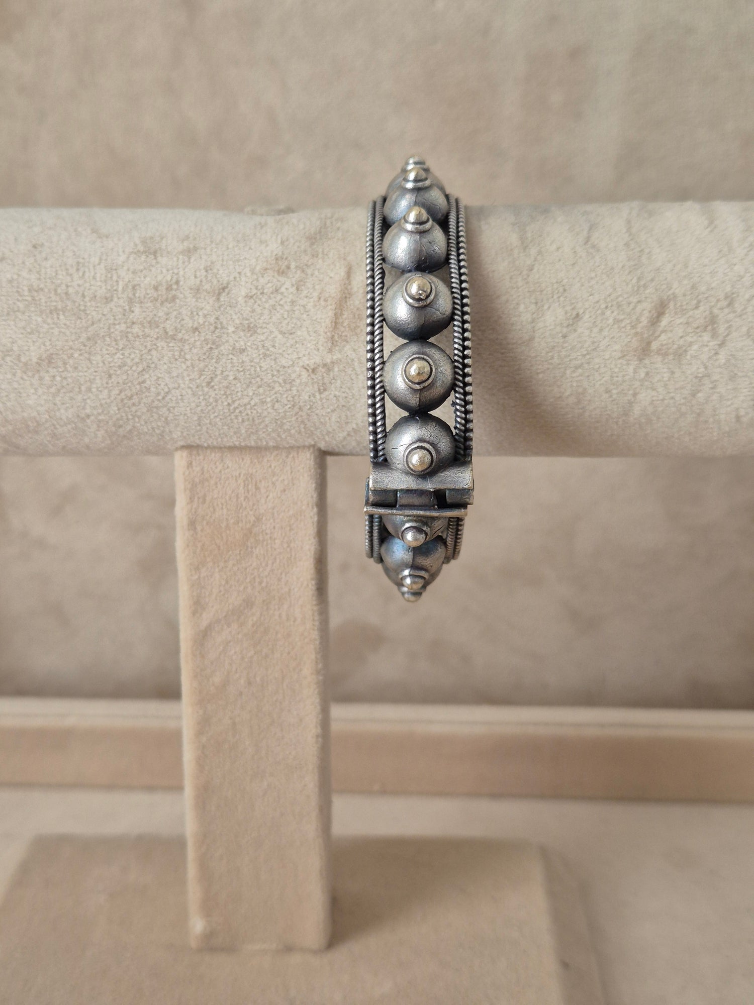 handcrafted silver oxidized Aksha bangle with intricate geometric and dome patterns by naitri.in