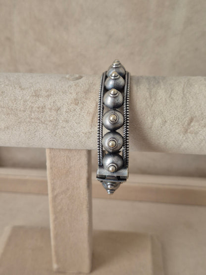 Premium oxidized silver bangle with detailed traditional metalwork by naitri.in