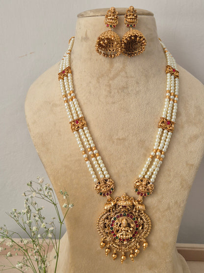 Handcrafted ethnic gold-plated pendant necklace with elegant pearl strands and temple jewelry motifs Indian style traditional pearl chain choker necklace and jhumka earring set from the NAITRI by naitri.in