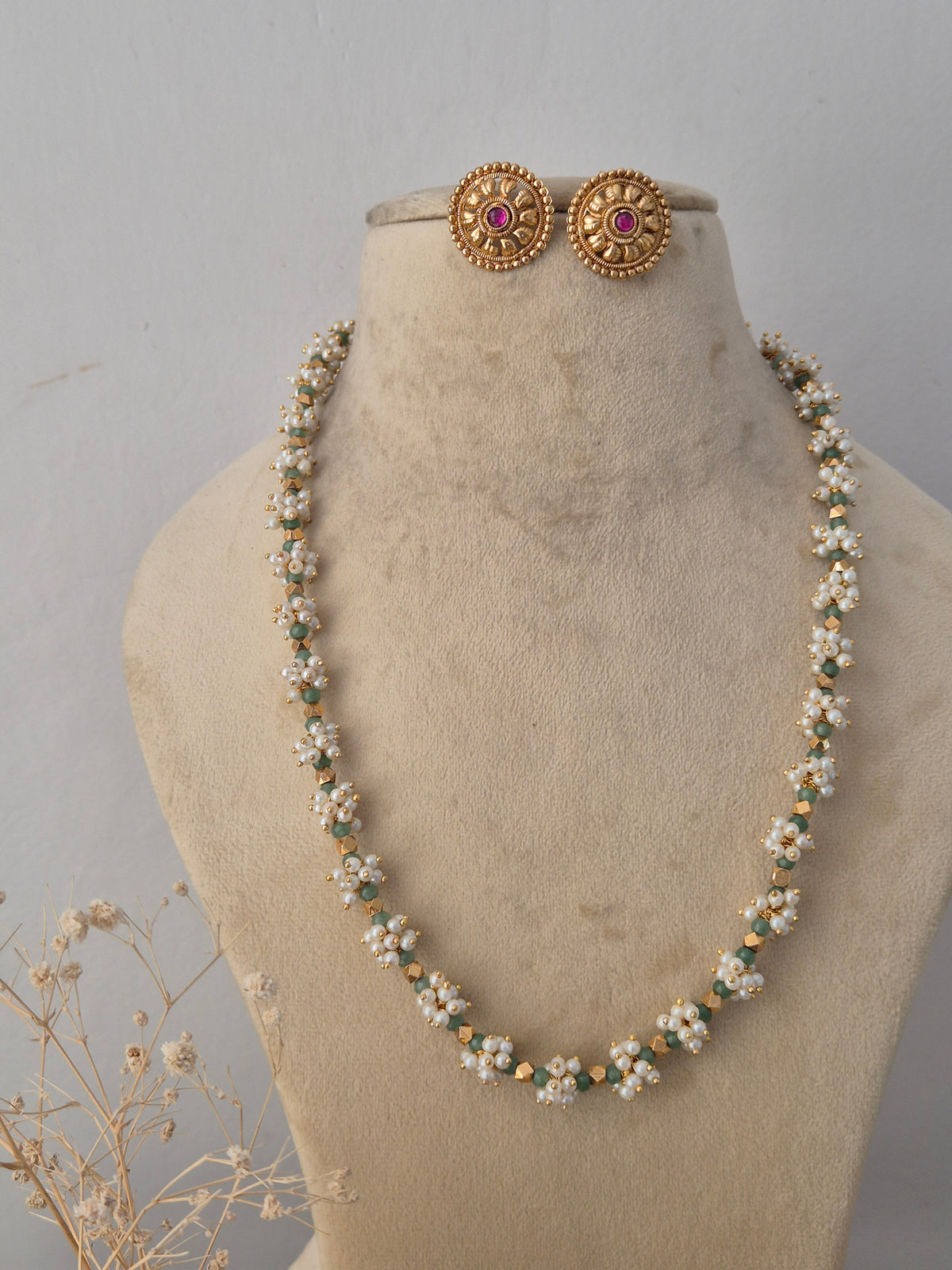 Traditional Indian ethnic gold and black bead necklace set with gemstone details by Naitri.in