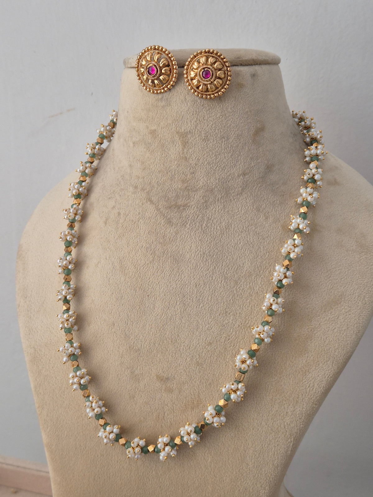 Gold-plated traditional Alankrita necklace and earring set by Naitri.in