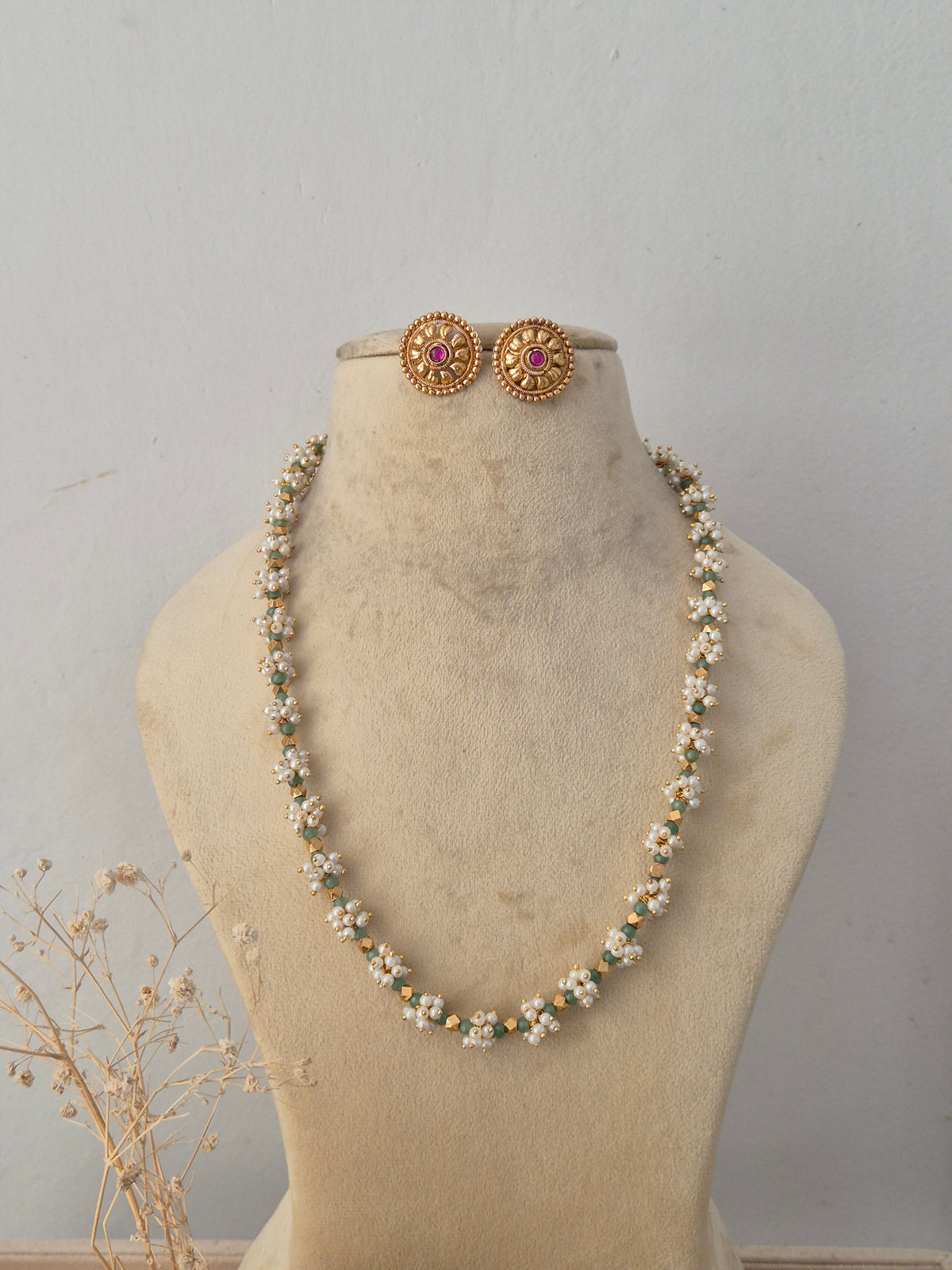 Handcrafted brass alloy traditional Indian pendant necklace on a black beaded chain with stone embellishments by Naitri.in