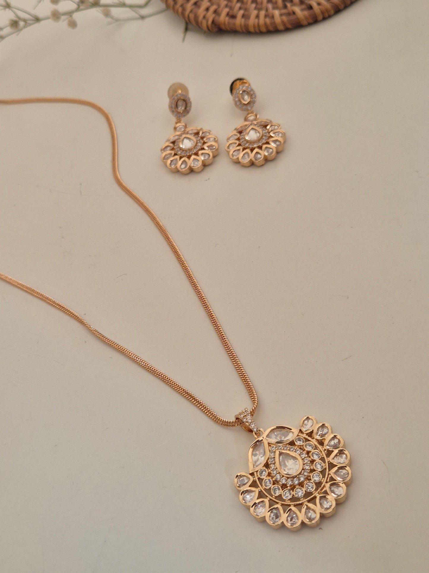 Elegant handcrafted American Diamond necklace and earring set on a display stand, ideal for weddings and special occasions by naitri.in