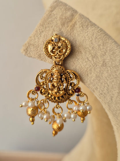 Artisanal Amarpali  earring in a modern Indian ethnic aesthetic dangling gold and pearls beads by naitri.in