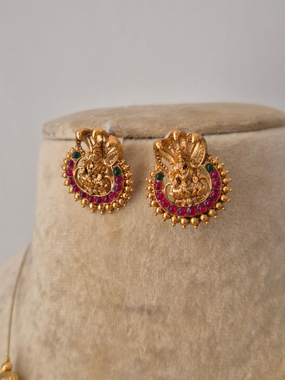 Gold-plated Amayra earrings with red-green stones and goddess motifs stud earrings.