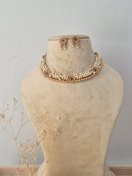 Traditional Indian pearl cluster choker necklace with subtle green and red stone accents by Naitri.in