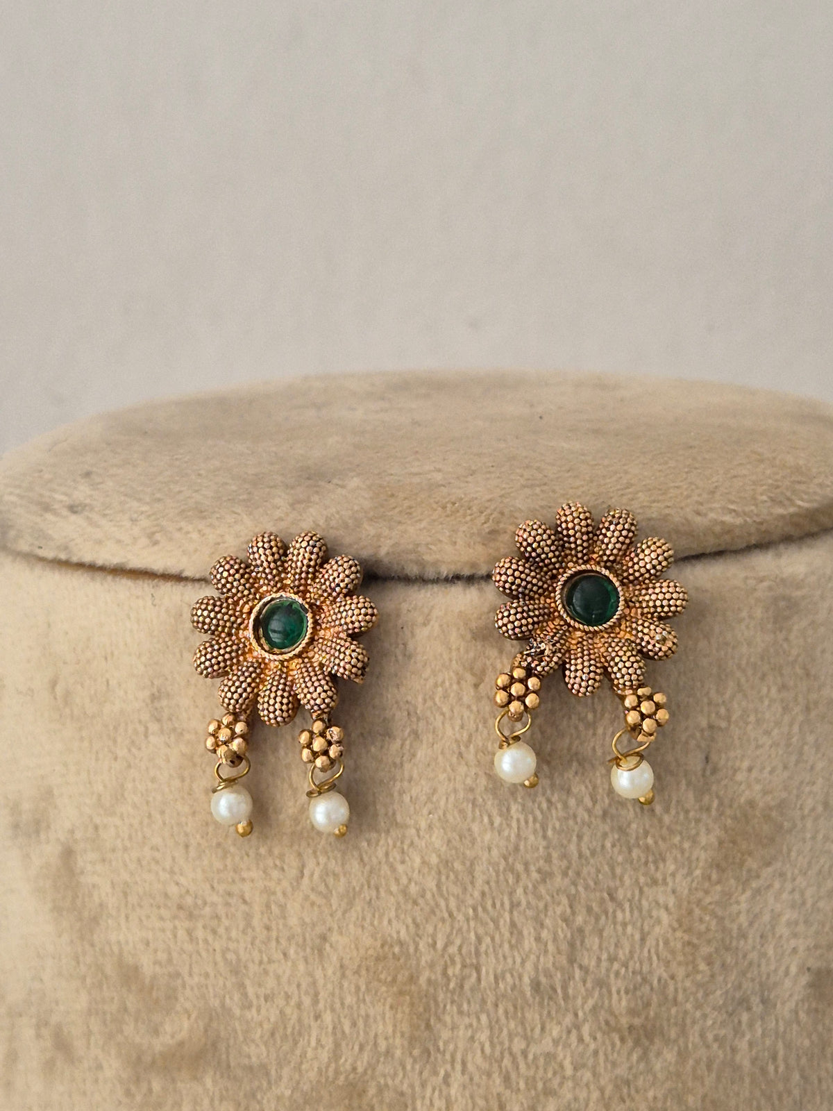 Handcrafted ethnic brass alloy choker featuring delicate pearl beads, textured gold accents, and matching earrings by Naitri.in
