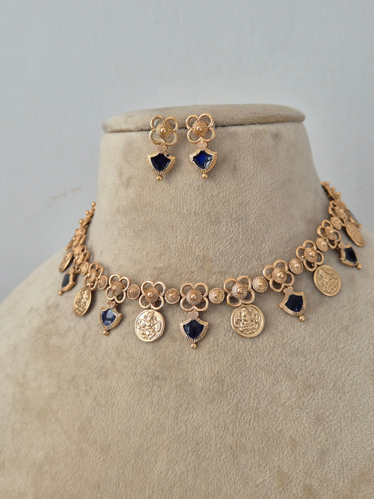 Traditional Indian Ethnic Pendant Set showcased against a clean background, highlighting the intricate artisanal metalwork, contrasting dark stone drops, and classic cultural styling by Naitri.in