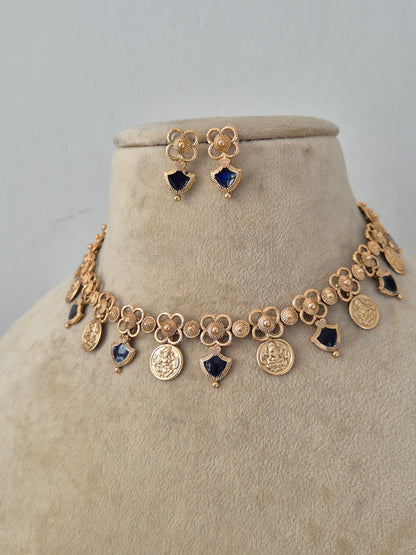 Traditional Indian Ethnic Pendant Set showcased against a clean background, highlighting the intricate artisanal metalwork, contrasting dark stone drops, and classic cultural styling by Naitri.in