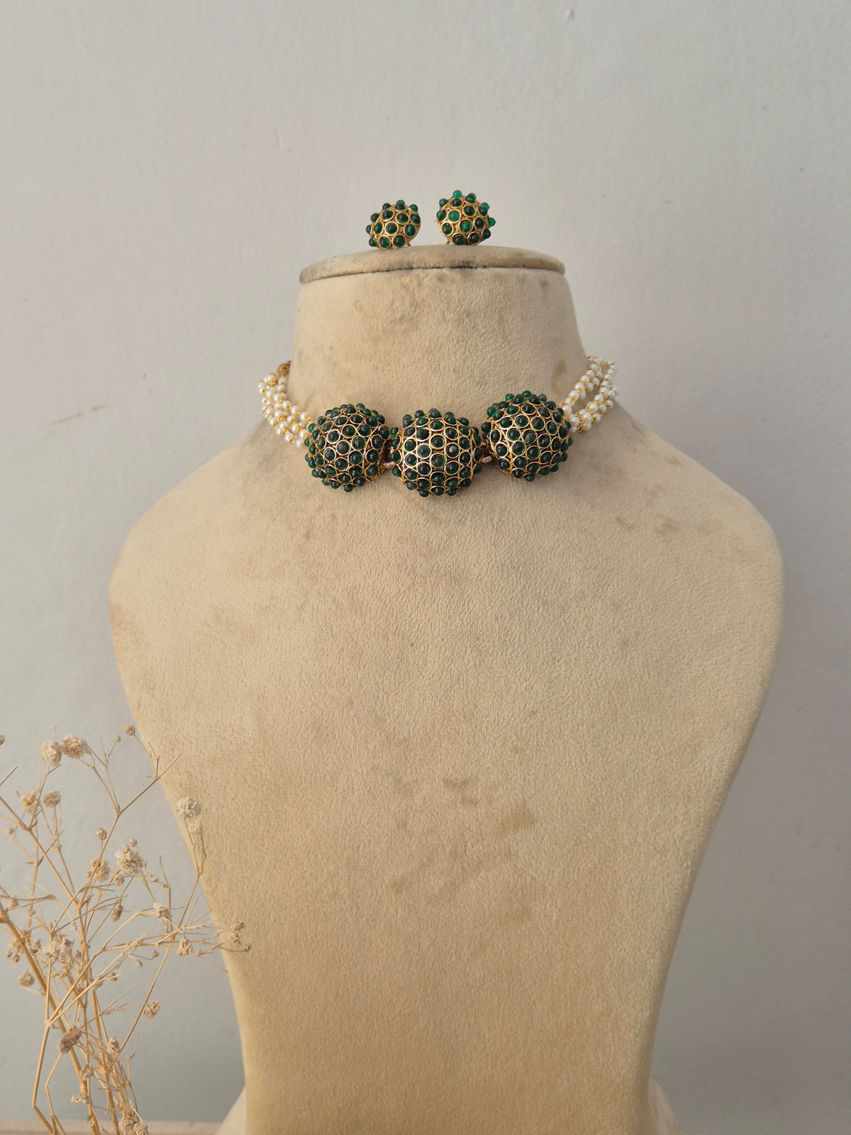 Anushree Necklace Set featuring a traditional gold mangalsutra-style black beaded chain with an intricate temple pendant and matching earrings by Naitri.in