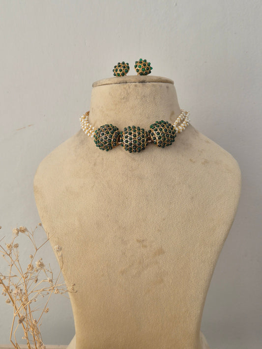 Anushree Necklace Set featuring a traditional gold mangalsutra-style black beaded chain with an intricate temple pendant and matching earrings by Naitri.in