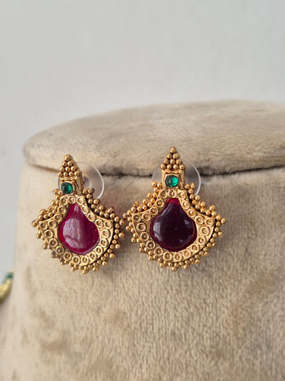 Gold-toned ethnic earring set with red and green stone accents by Naitri.in