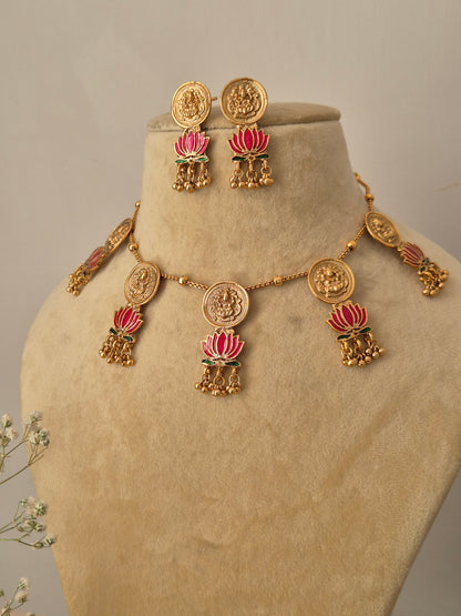 Handcrafted brass alloy jewelry set with traditional coin-style motifs, pink enamel lotus charms, and small Jhumka drops by naitri.in
