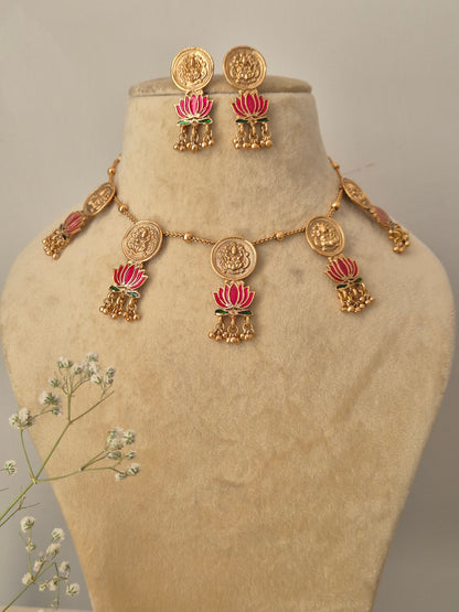 Gold-plated temple jewelry featuring Goddess motifs, pink lotus charms, and matching Jhumka earrings by naitri.in