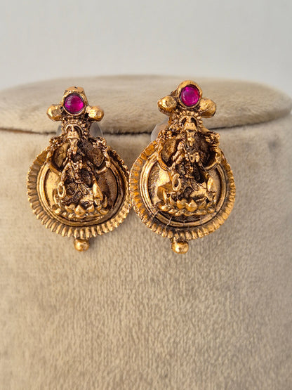 Close-up of a traditional Indian multi-strand pearl and gold-toned necklace set featuring a detailed pendant by Naitri.in