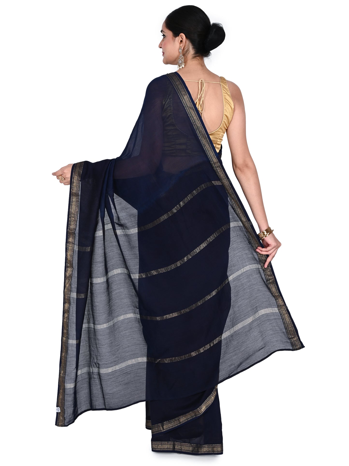 Full-length view of a navy blue cotton-silk saree showing the fluid drape, subtle silk sheen, and intricate traditional prints by naitri.in