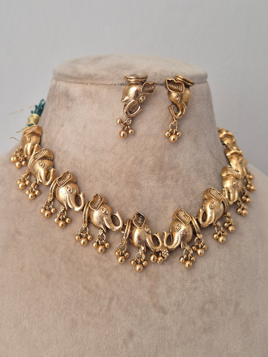 Gold necklace with very detailed designs ten elephants faces connected and hanged golden beads by naitri.in