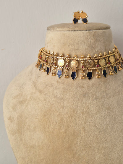 Elegant multi-colored stone and gold-toned traditional choker jewelry set, by naitri.in