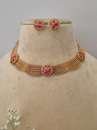 Gold imitation choker necklace with pink floral stones and matching stud earrings, Naitri gold-plated Bina necklace and earring set with pink gemstones by naitri.in