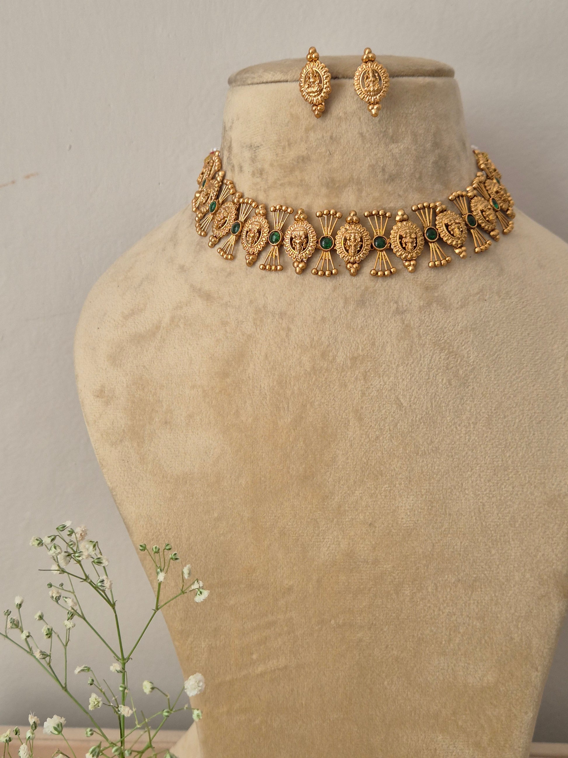 Gold-toned antique choker necklace and matching teardrop earrings, Antique gold-plated statement choker necklace and earring set paired by naitri.in