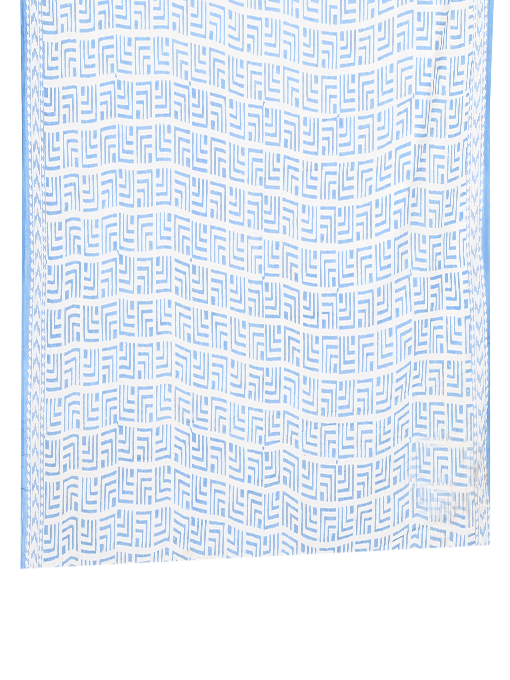 Classic drape of a Brishti cotton saree in white with blue patterns, ideal for casual daywear and modern Indian styling with a matching blouse piece by naitri.in
