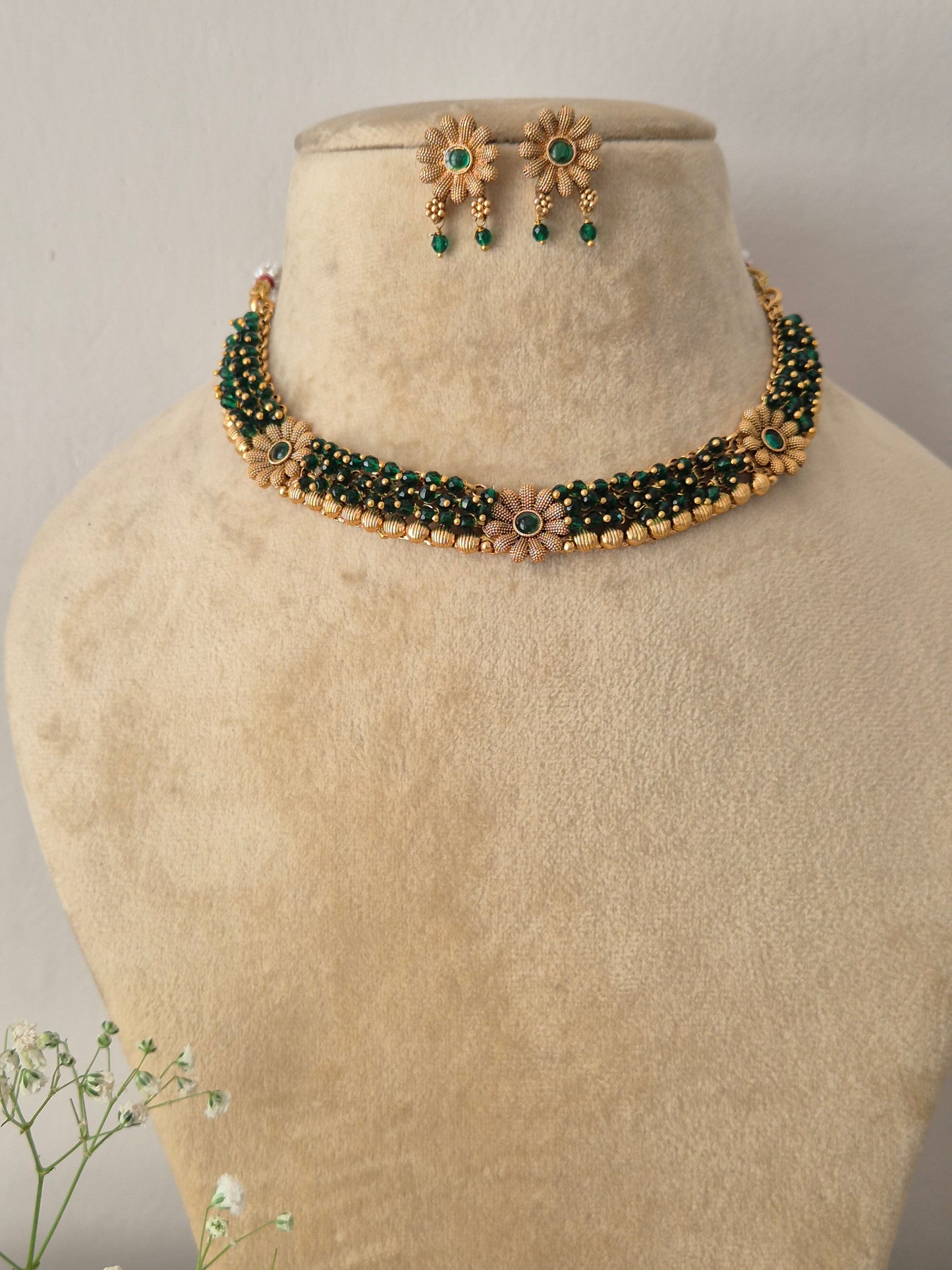 Elegant gold-toned ethnic choker jewelry set with intricate green beaded strands, by naitri.in