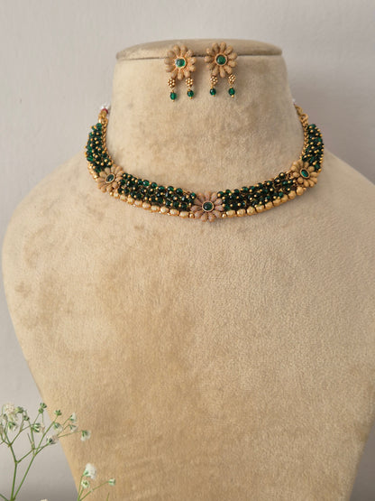 Elegant gold-toned ethnic choker jewelry set with intricate green beaded strands, by naitri.in