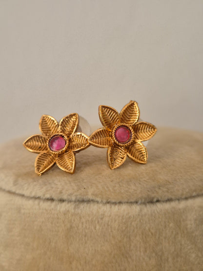 Gold-plated floral earrings with pink-red stones by naitri.in