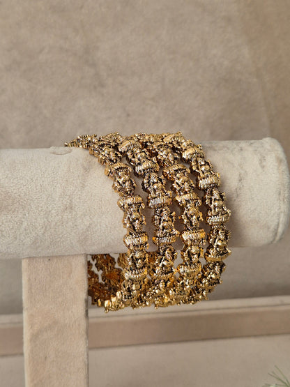 A wide, multi-strand cuff bracelet with textured gold and silver metallic links traditional gold temple jewellery bangles set of 4 by naitri.in