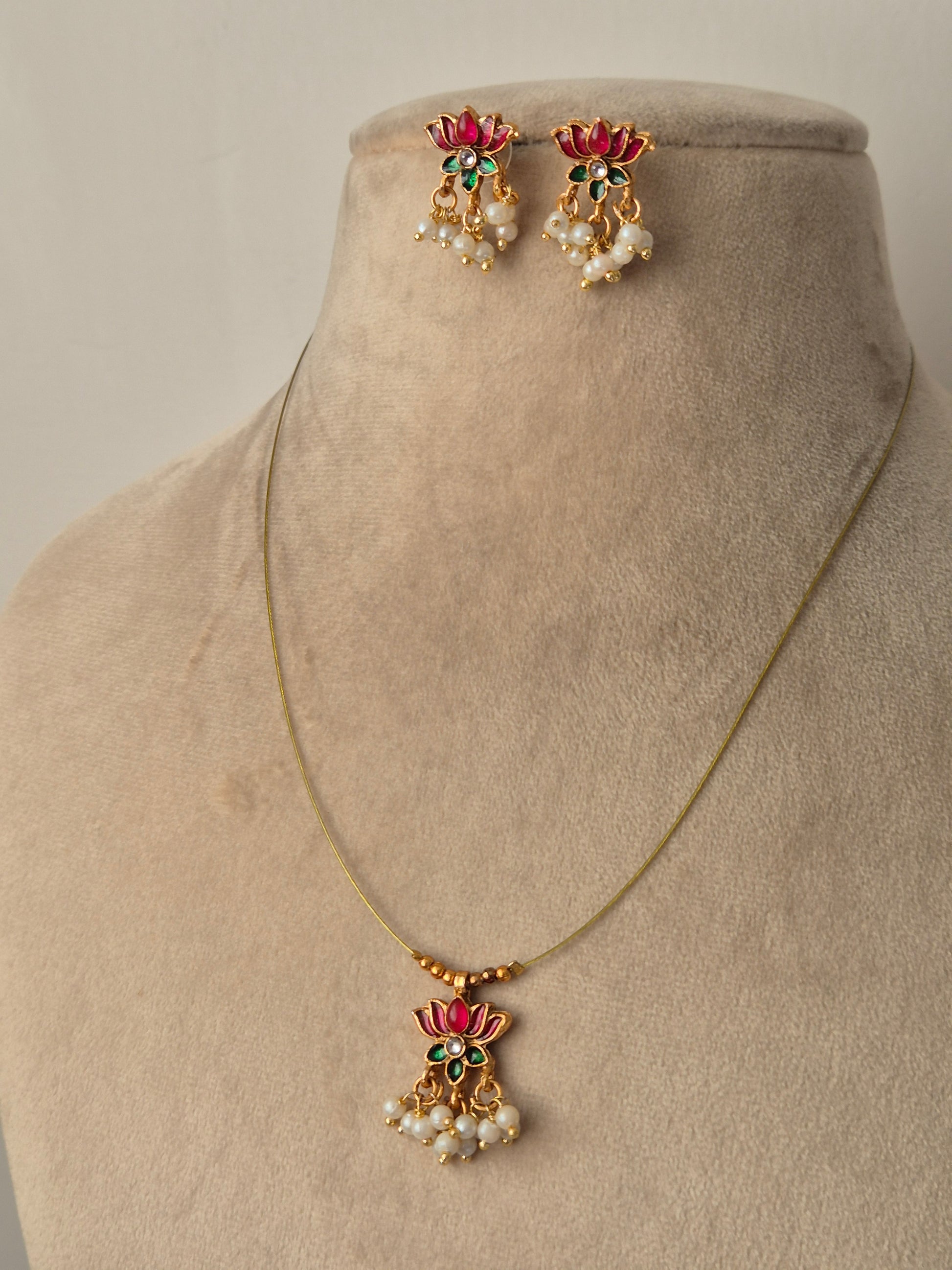 Gold plated necklace and earrings with pink lotus, golden beads and small stone in middle, some small pearls, Timeless, High-quality by naitri.in