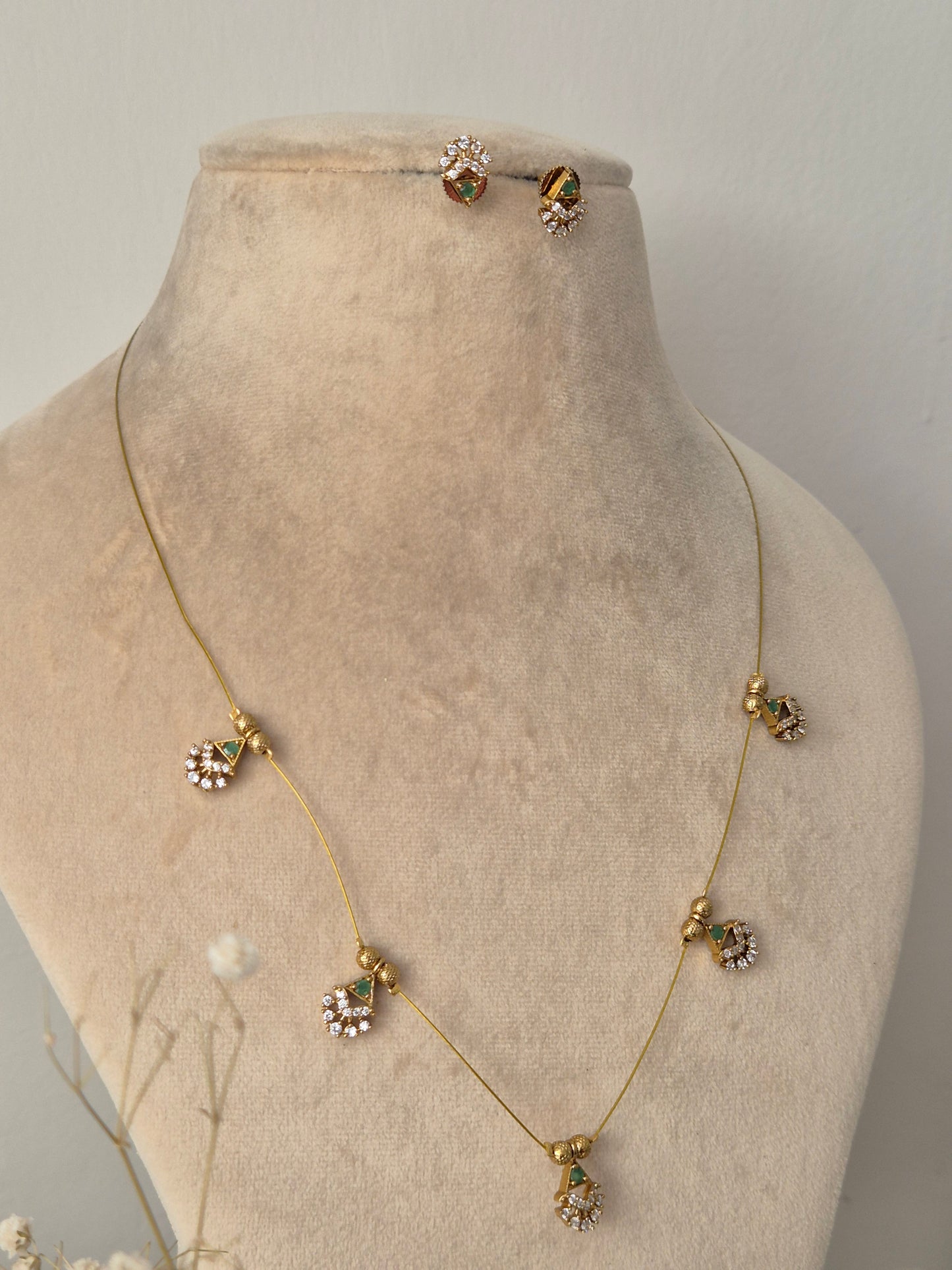 Gold plated necklace and earrings with green gemstone, Timeless, High-quality by naitri.in