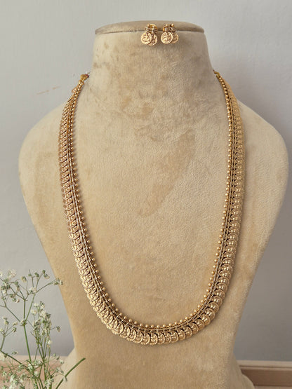 Long antique gold chain necklace with intricate textured detailing and matching small stud earrings, by naitri.in
