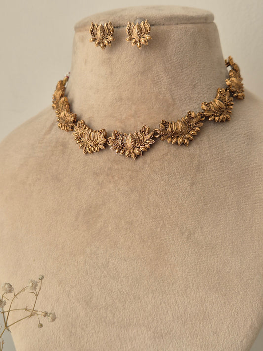 Deepmala Necklace Set - Golden floral brass jewelry with matching earrings. by naitri.in
