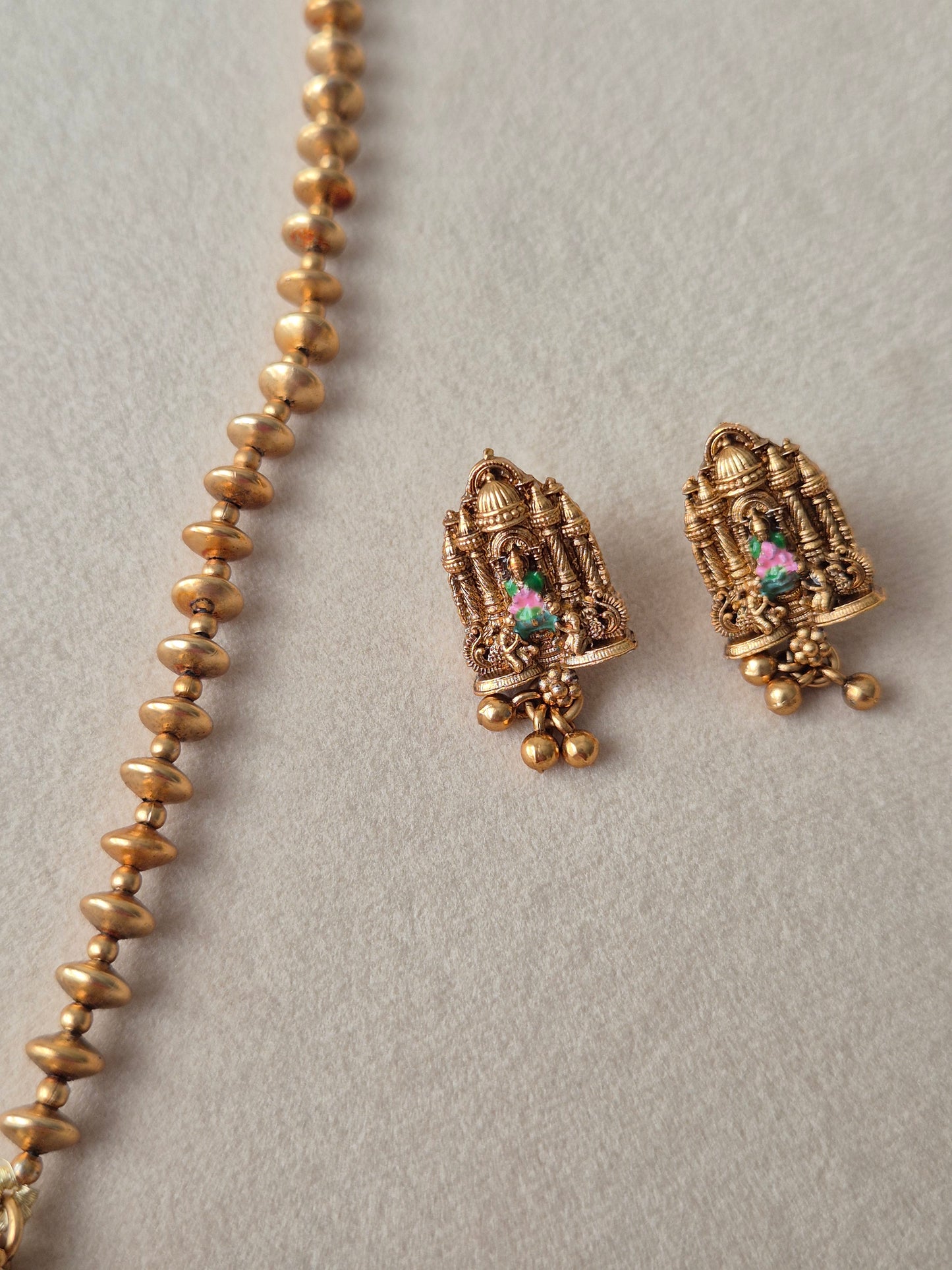 Golden Ethnic Earring with Temple Jewellery" and "Goddess motifs" modern Indian aesthetic by naitri.in