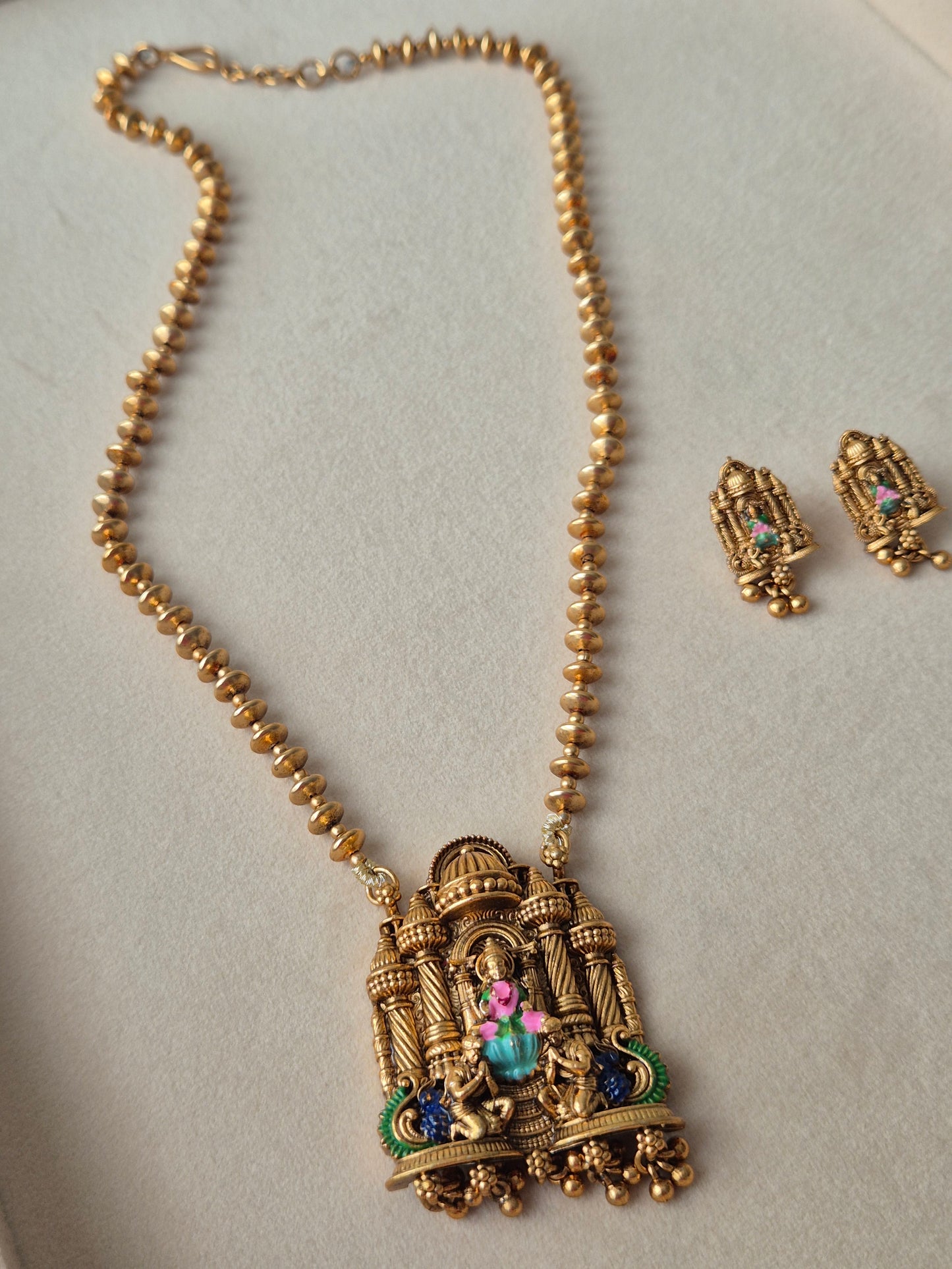 "Temple Jewellery" and "Goddess motifs" is crucial for this specific piece, as it aligns with the "modern Indian aesthetic by naitri.in