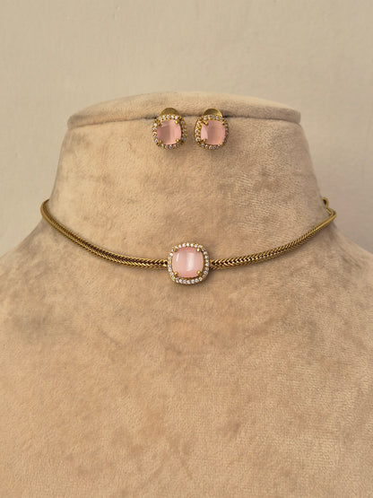 Gold chain choker necklace set with a pink stone center Delicate gold choker necklace with a blush pink stone pendant and matching stud earrings by naitri.in