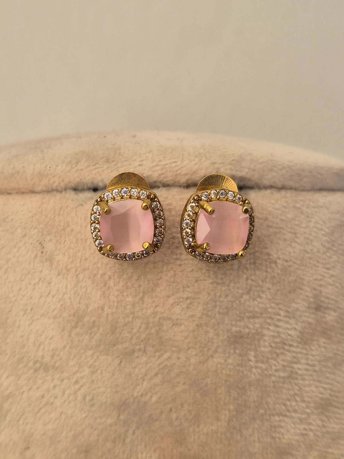 Delicate gold earrings e with a blush pink stone pendan tsurrounded by small crystals, by naitri.in
