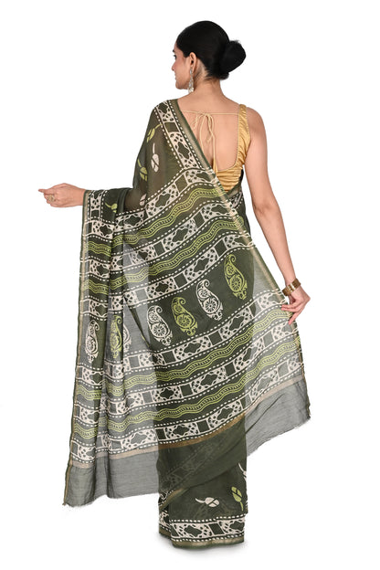 Full-length view of the saree in a dark olive green cotton-silk blend, showing the fluid drape and intricate white artisanal block prints from Madhya Pradesh by naitri.in