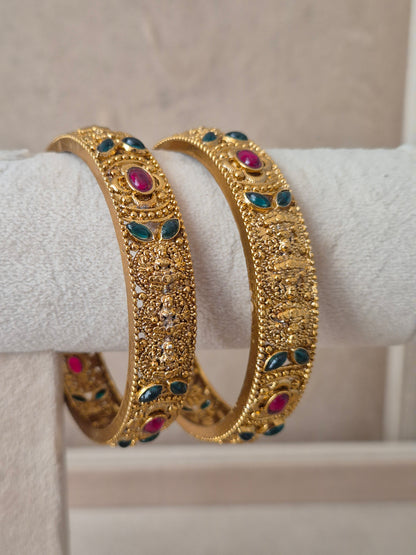 Dhanashree Bangles set of 2, traditional Indian gold-plated bangles with red and green stones, ethnic festive and bridal jewelry collection by Naitri.in