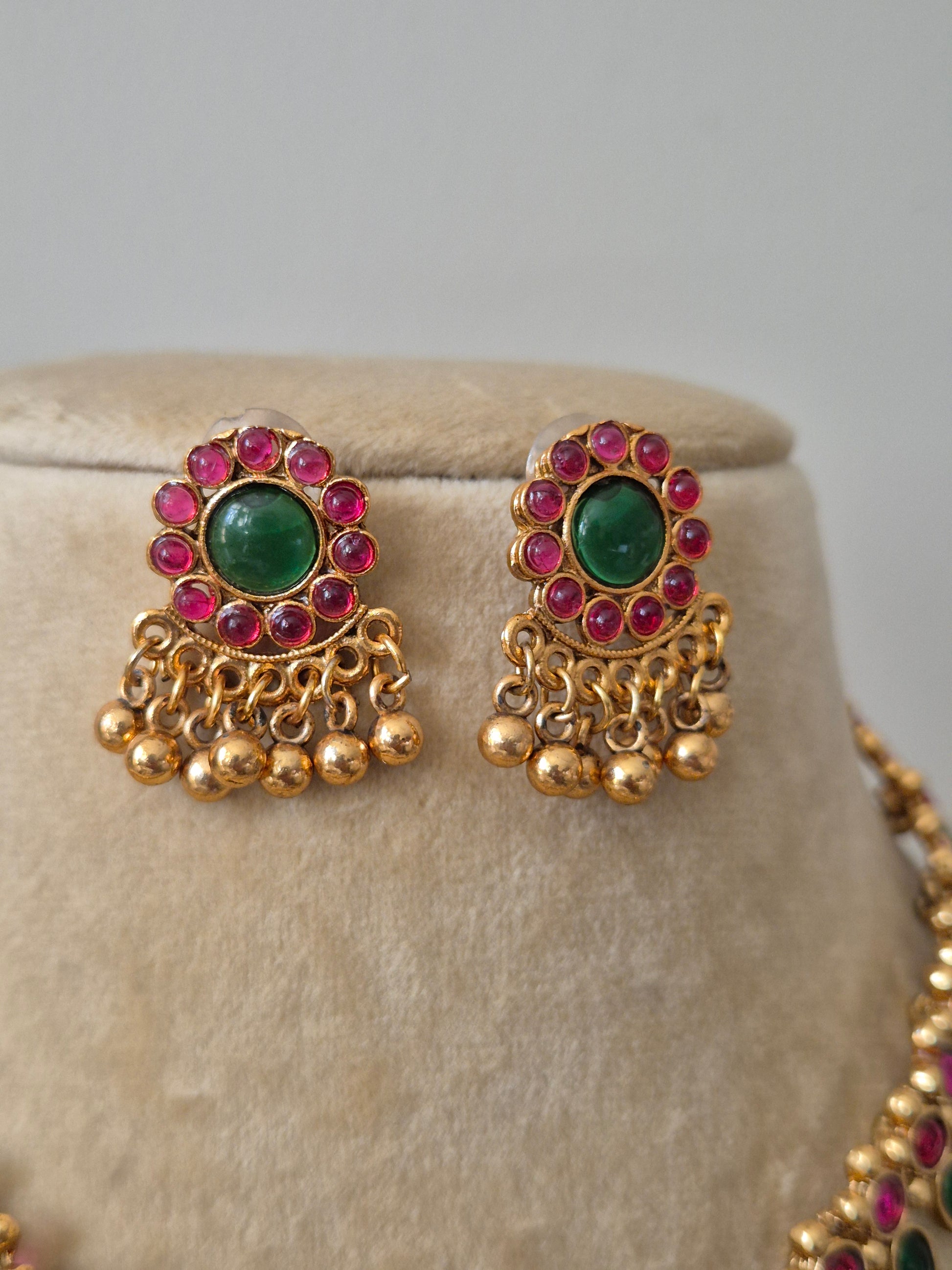 Gold-finish brass alloy earring with ruby-red and emerald-green stones and gold beads drops by naitri.in