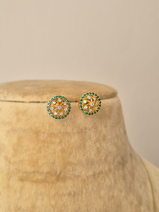A delicate gold-toned invisible chain necklace featuring a round floral-inspired pendant with American diamonds and green beads, paired with matching round studs by naitri.in