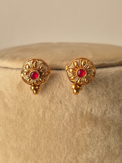 Gold earrings with red gemstones and the "golden brass" material, handcrafted earrings by naitri.in