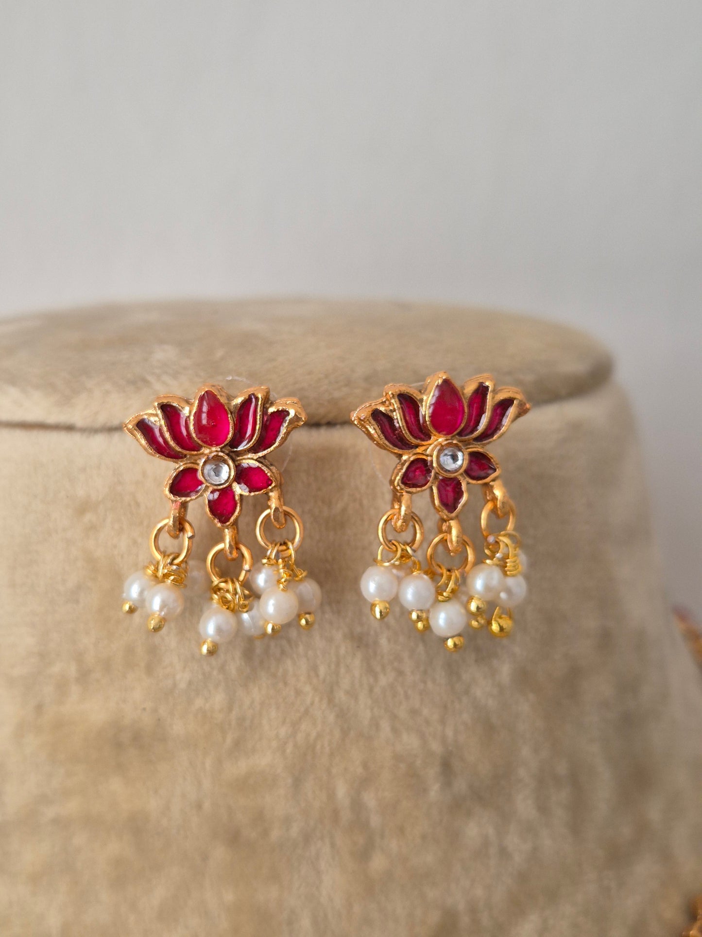 Antique intricate ruby-pink lotus-shaped accents and hanging pearl clusters earrings by naitri.in
