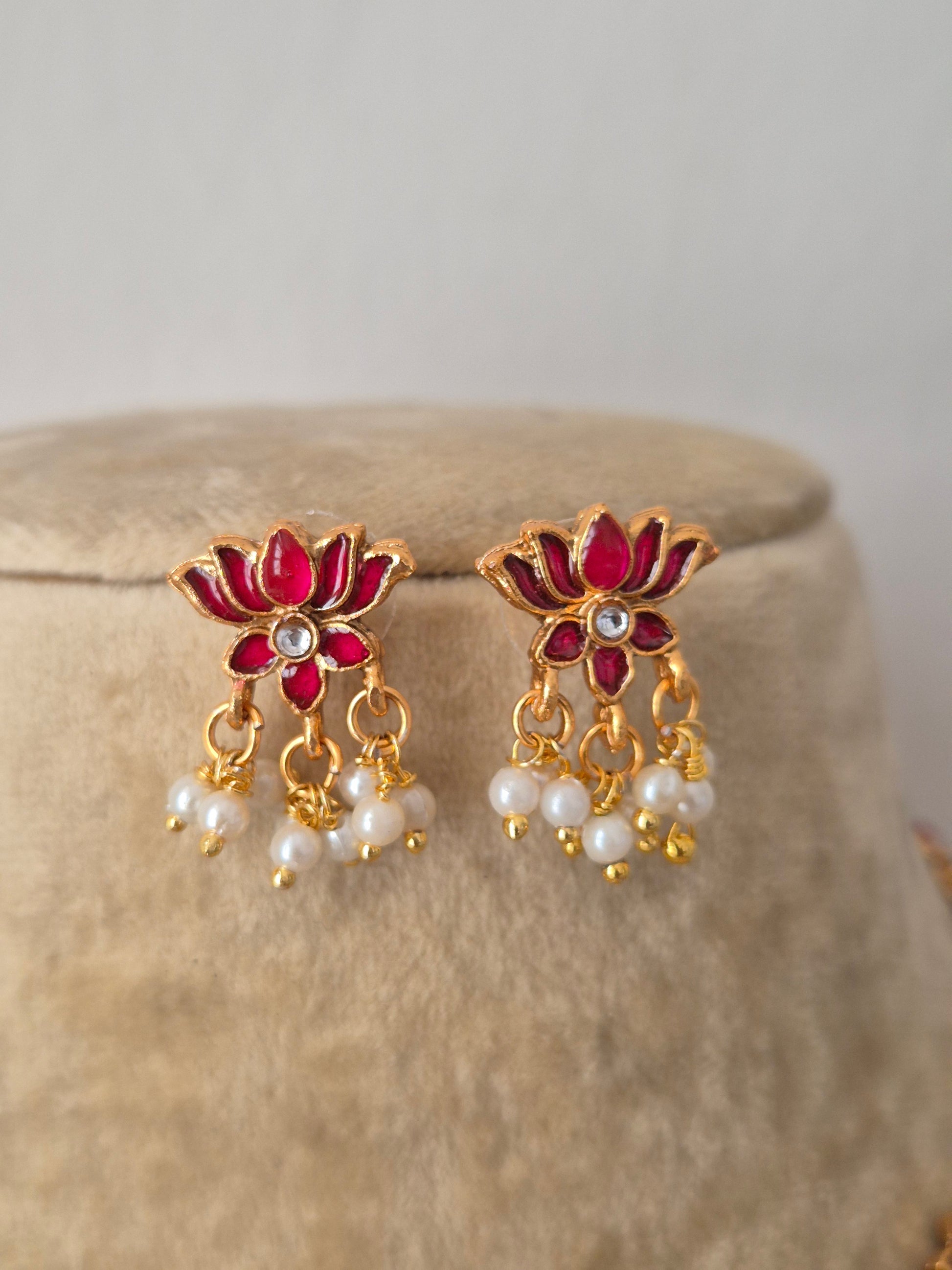 Antique intricate ruby-pink lotus-shaped accents and hanging pearl clusters earrings by naitri.in